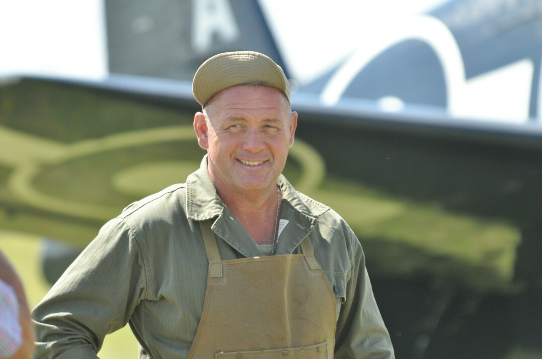 Portrait of a smiling man in a work shirt